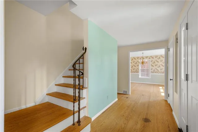 a view of entryway with wooden floor