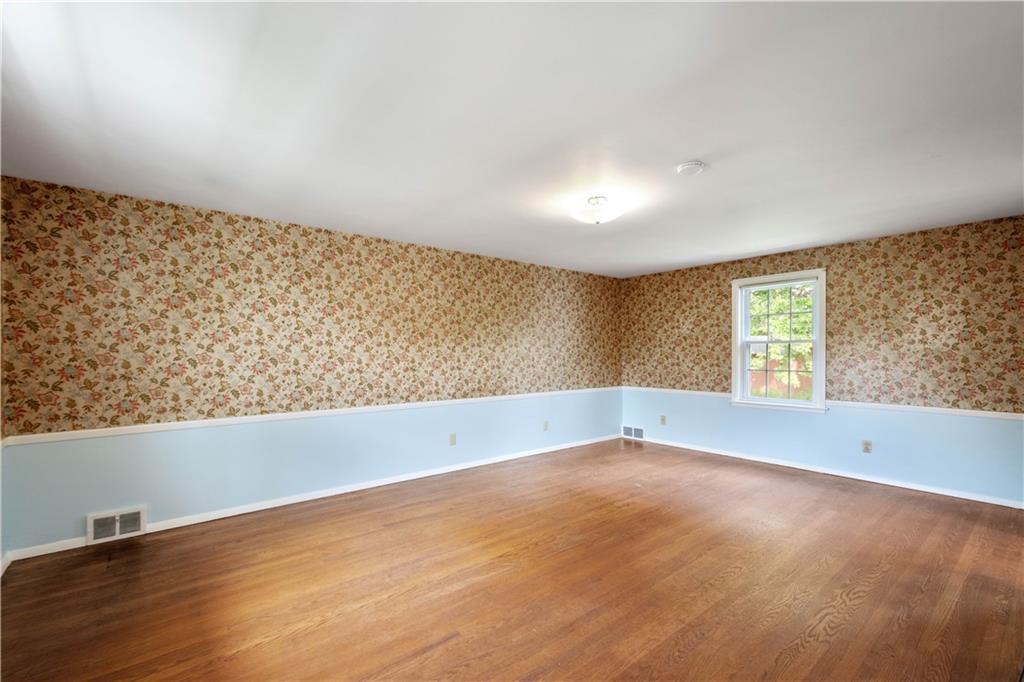 1413 Terrace Drive Pittsburgh, PA 15228 - Photo 30 of 50 an empty room with wooden floor and windows