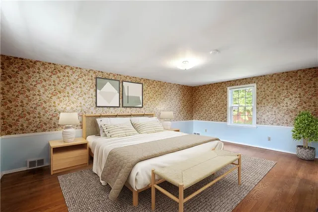 a bedroom with a bed and window