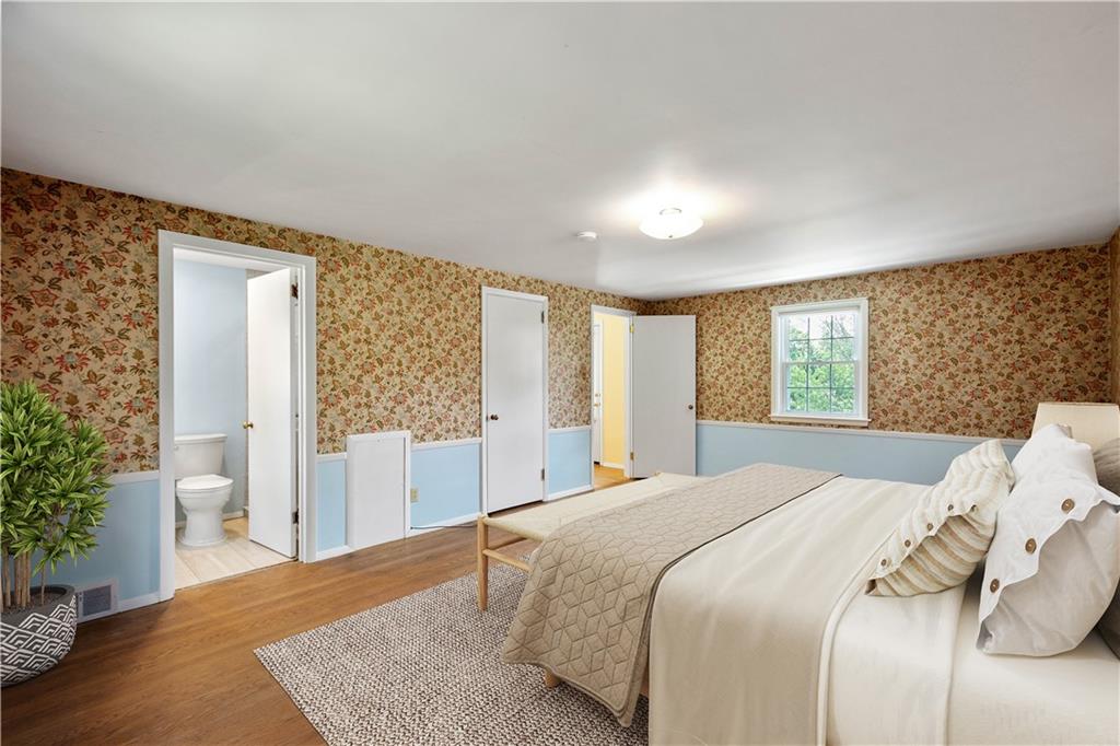 1413 Terrace Drive Pittsburgh, PA 15228 - Photo 33 of 50 a bedroom with a large bed and a large window