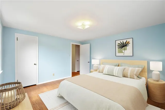 a bedroom with a bed and a lamp