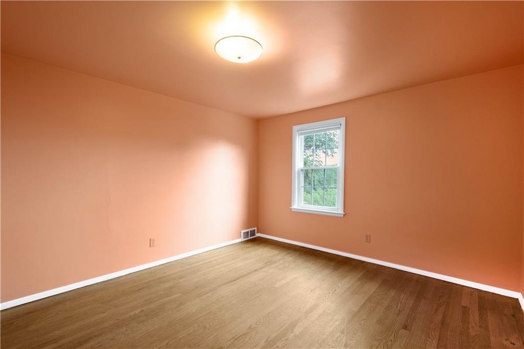 1413 Terrace Drive Pittsburgh, PA 15228 - Photo 44 of 50 an empty room with wooden floor and windows