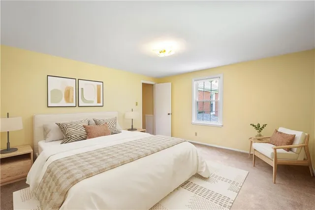 a bedroom with a bed and a couch