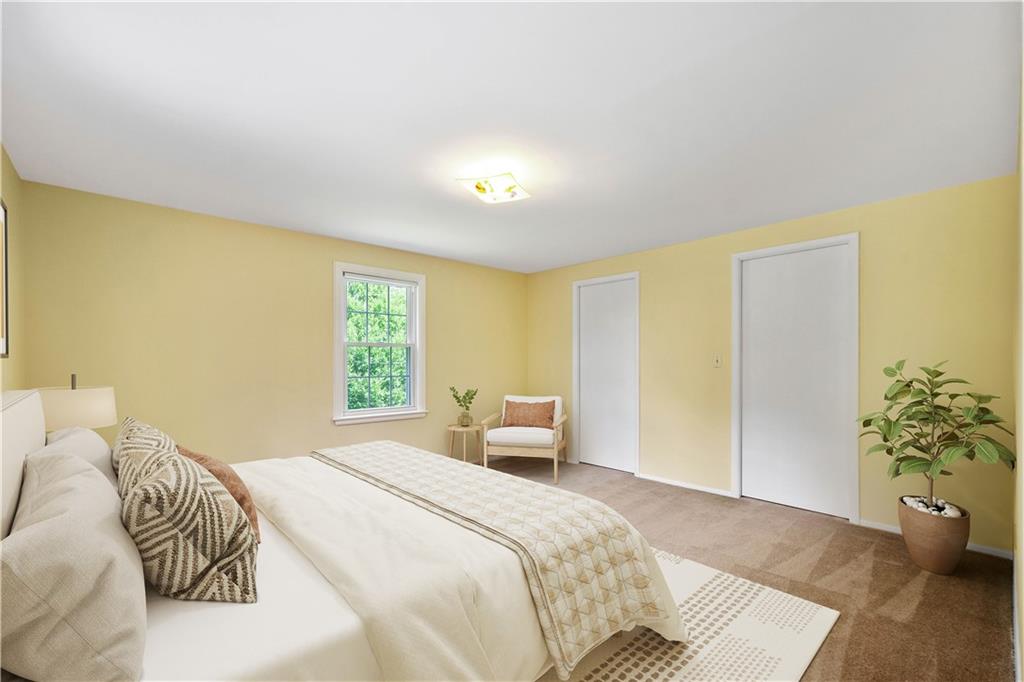 1413 Terrace Drive Pittsburgh, PA 15228 - Photo 49 of 50 a bedroom with a bed and a potted plant