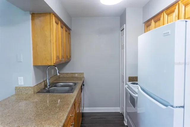 a bathroom with a sink a vanity and a mirror