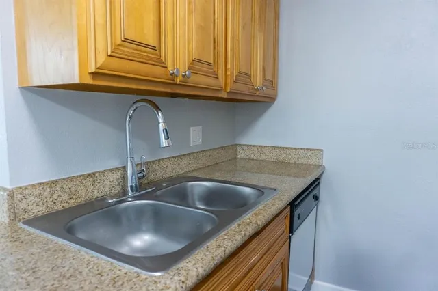 a kitchen with a sink and a window