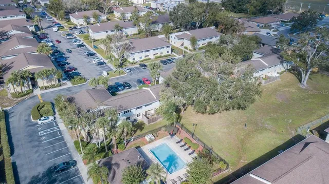 an aerial view of a house with a yard