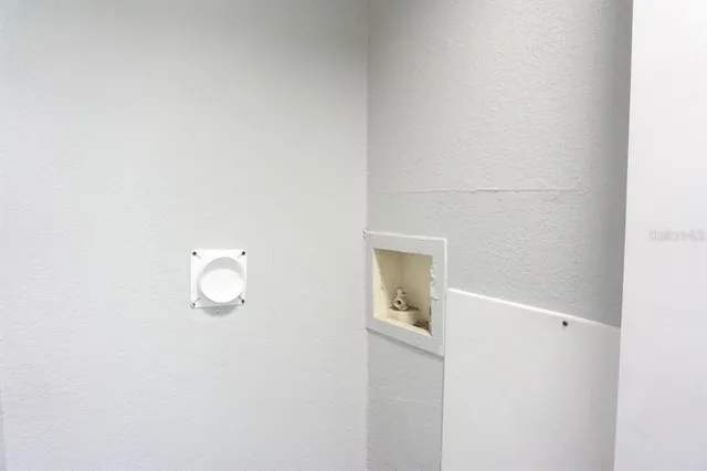 a view of a bathroom with mirror