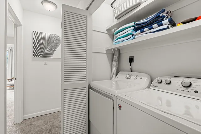 aerial view of a house with a lake view