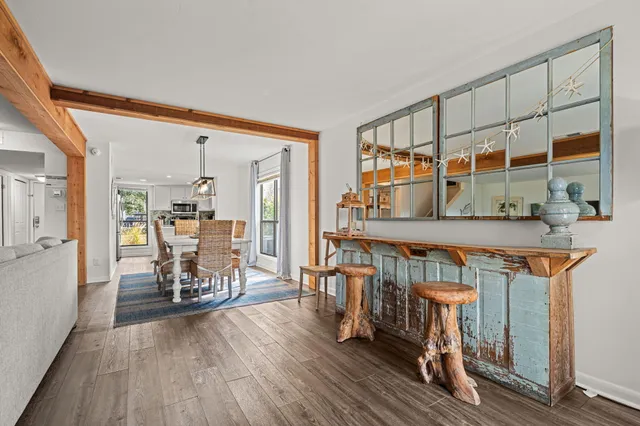 a kitchen with stainless steel appliances a microwave a stove and a refrigerator