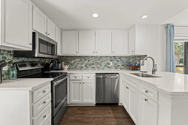 a dining room with furniture window and wooden floor