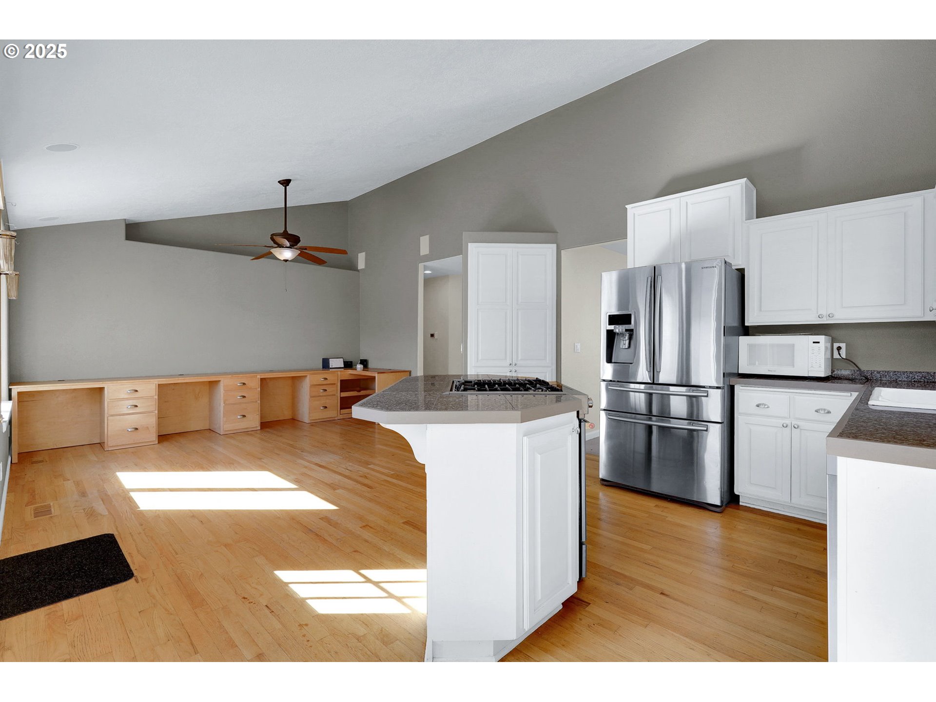 1587 Manchester Drive Eugene, OR 97401 - Photo 12 of 31 a open kitchen with stainless steel appliances granite countertop a sink a stove and a refrigerator