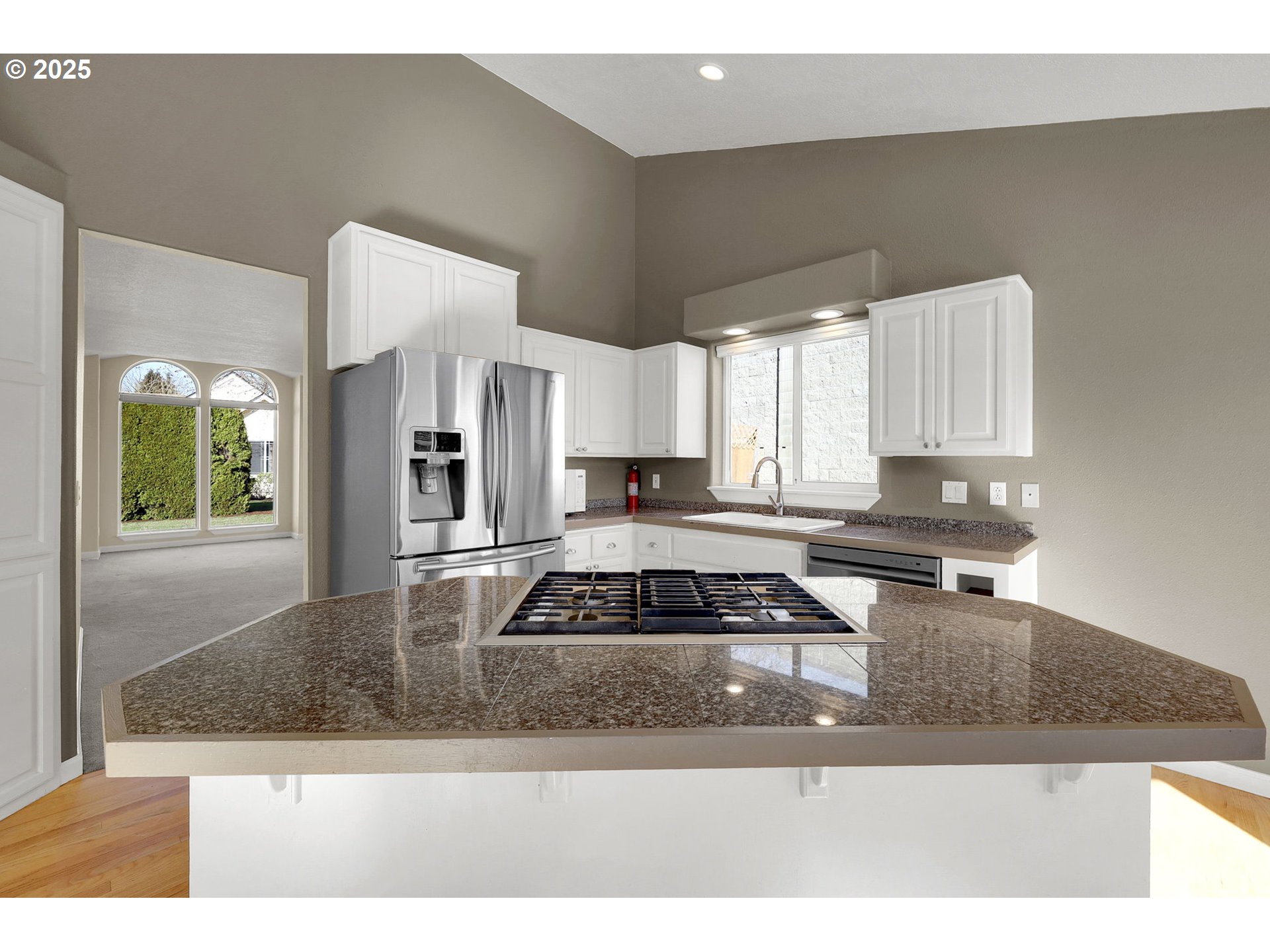 1587 Manchester Drive Eugene, OR 97401 - Photo 14 of 31 a kitchen with granite countertop a stove a sink and a granite counter tops