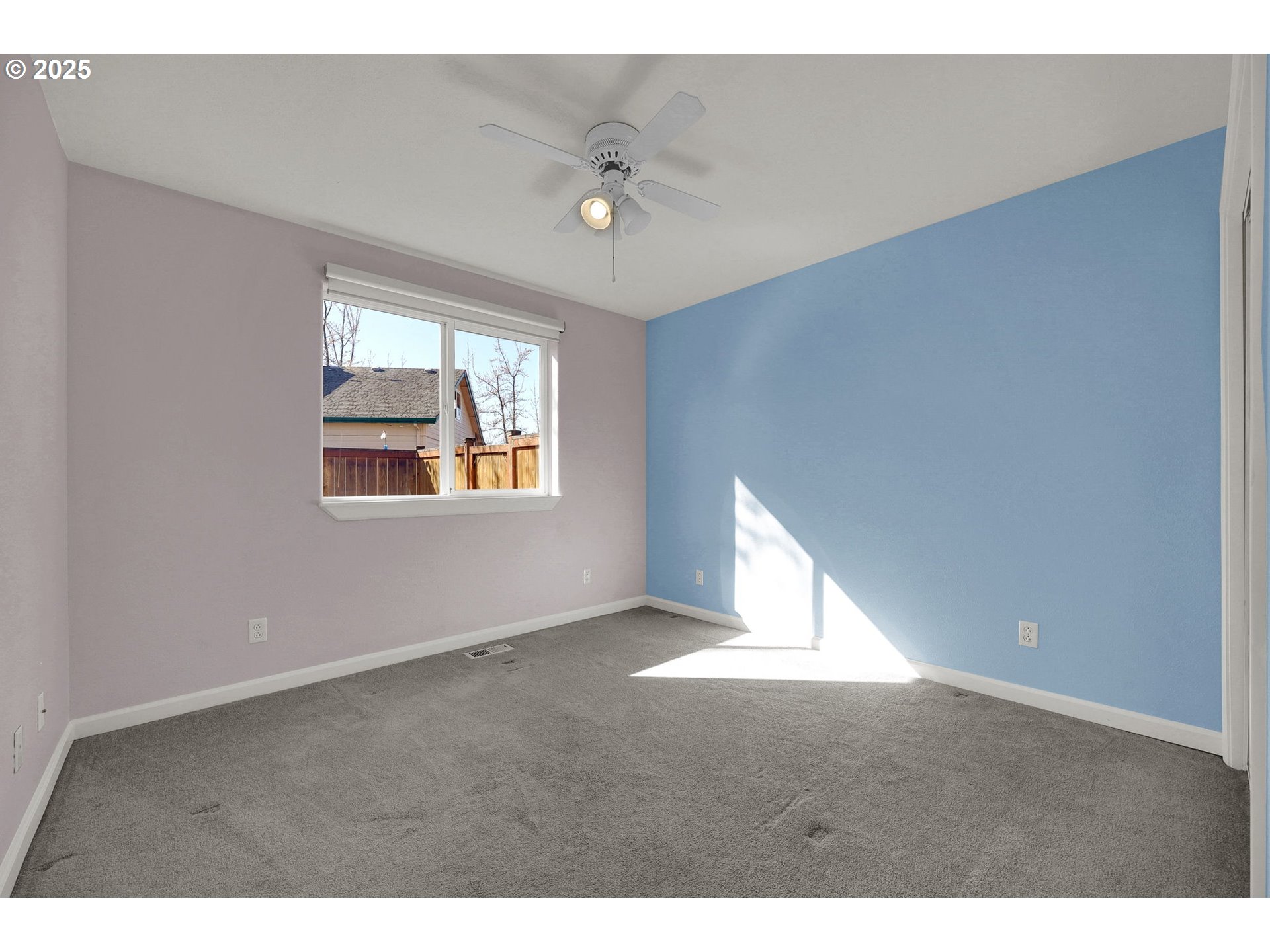 1587 Manchester Drive Eugene, OR 97401 - Photo 20 of 31 a view of an empty room with wooden floor and windows