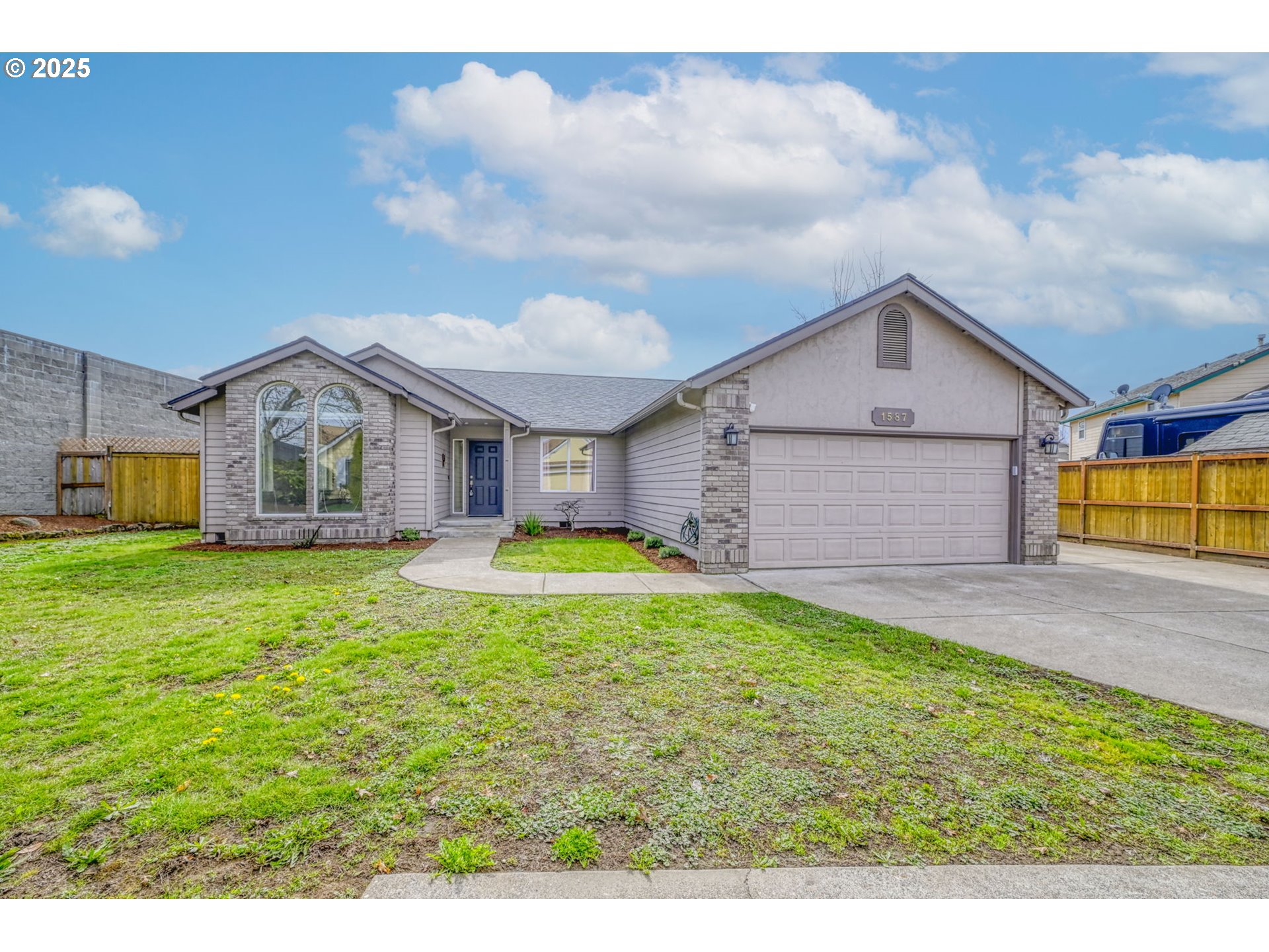 1587 Manchester Drive Eugene, OR 97401 - Photo 2 of 31 a view of a house with a backyard