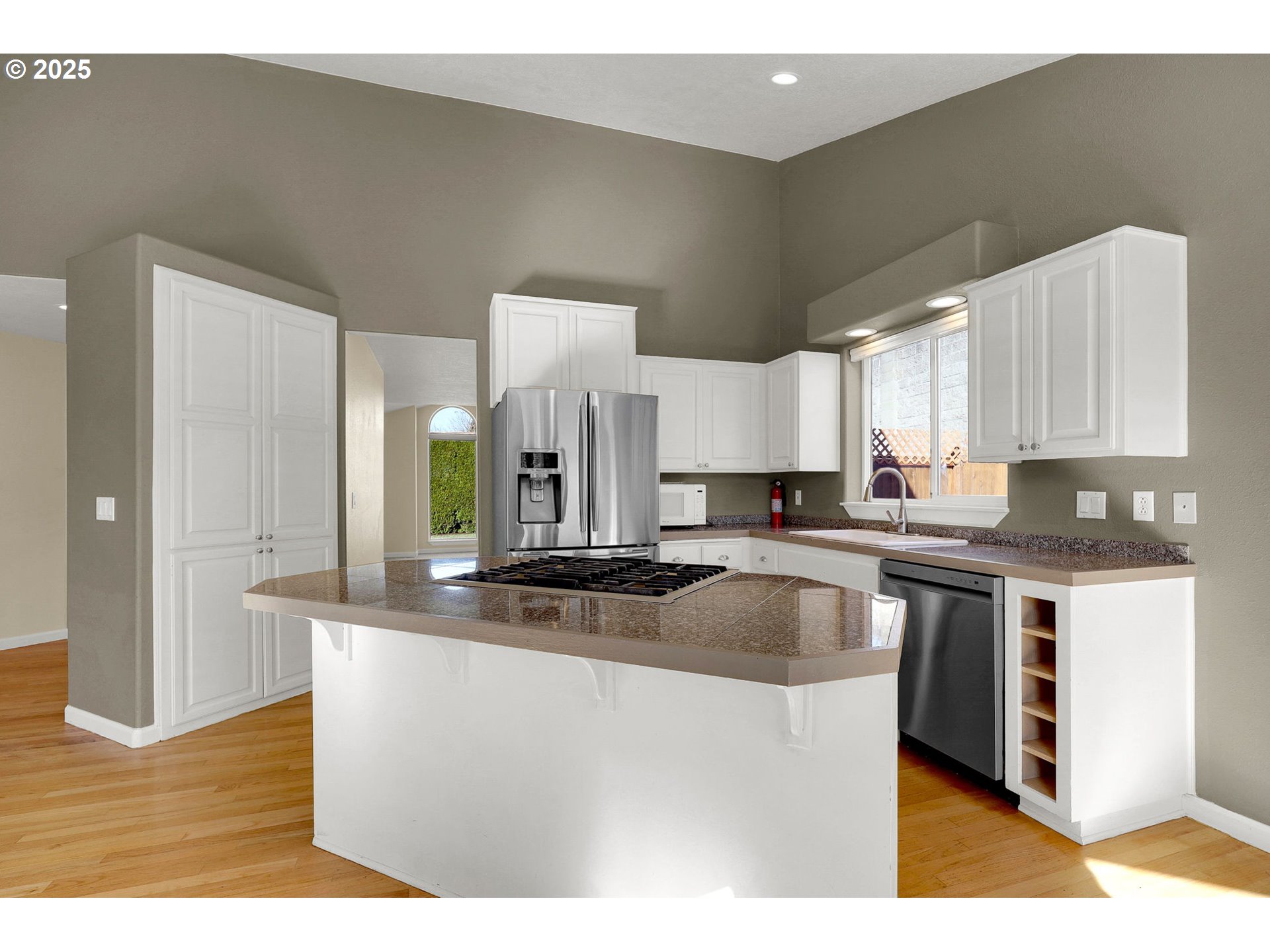 1587 Manchester Drive Eugene, OR 97401 - Photo 9 of 31 a kitchen with stainless steel appliances granite countertop a sink a stove and a refrigerator