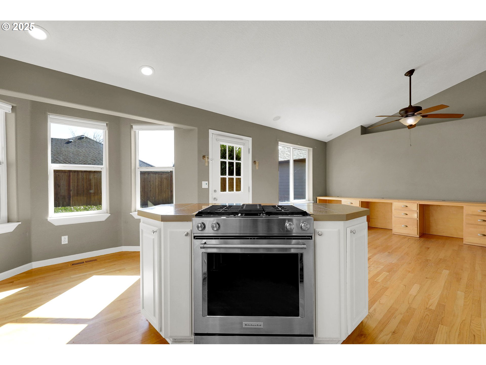 1587 Manchester Drive Eugene, OR 97401 - Photo 10 of 31 a kitchen with a stove and a wooden floor