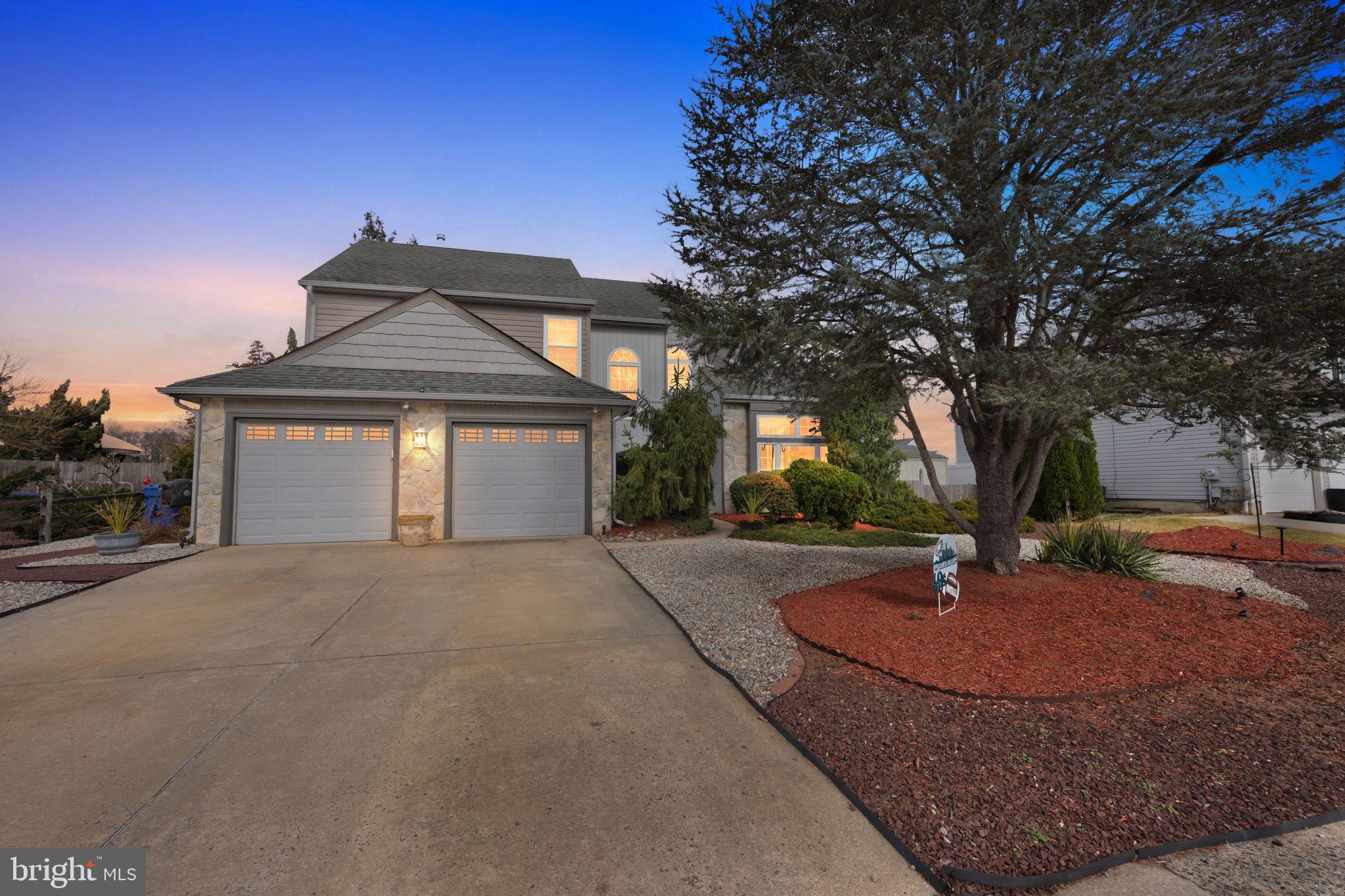 a front view of a house with yard