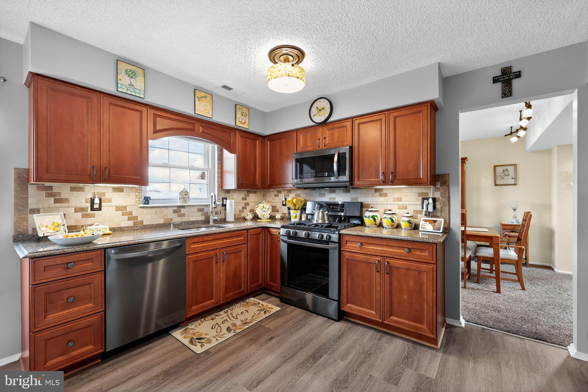 11 Pony Run Sewell, NJ 08080 - Photo 13 of 33 a kitchen with granite countertop appliances cabinets and a sink
