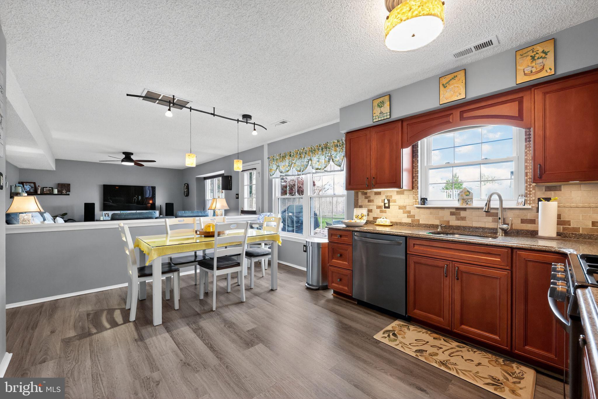 11 Pony Run Sewell, NJ 08080 - Photo 14 of 33 a large kitchen with a table and chairs in it