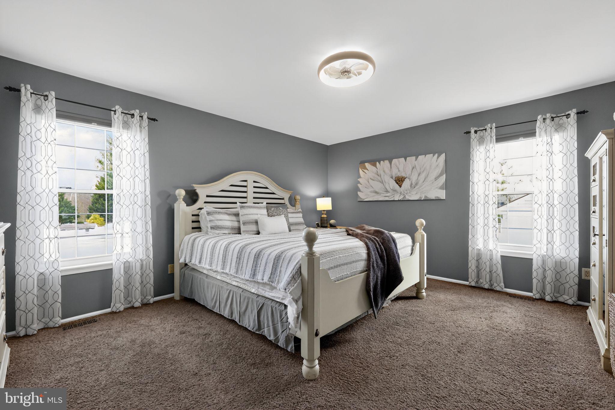 11 Pony Run Sewell, NJ 08080 - Photo 22 of 33 a spacious bedroom with a bed and a window