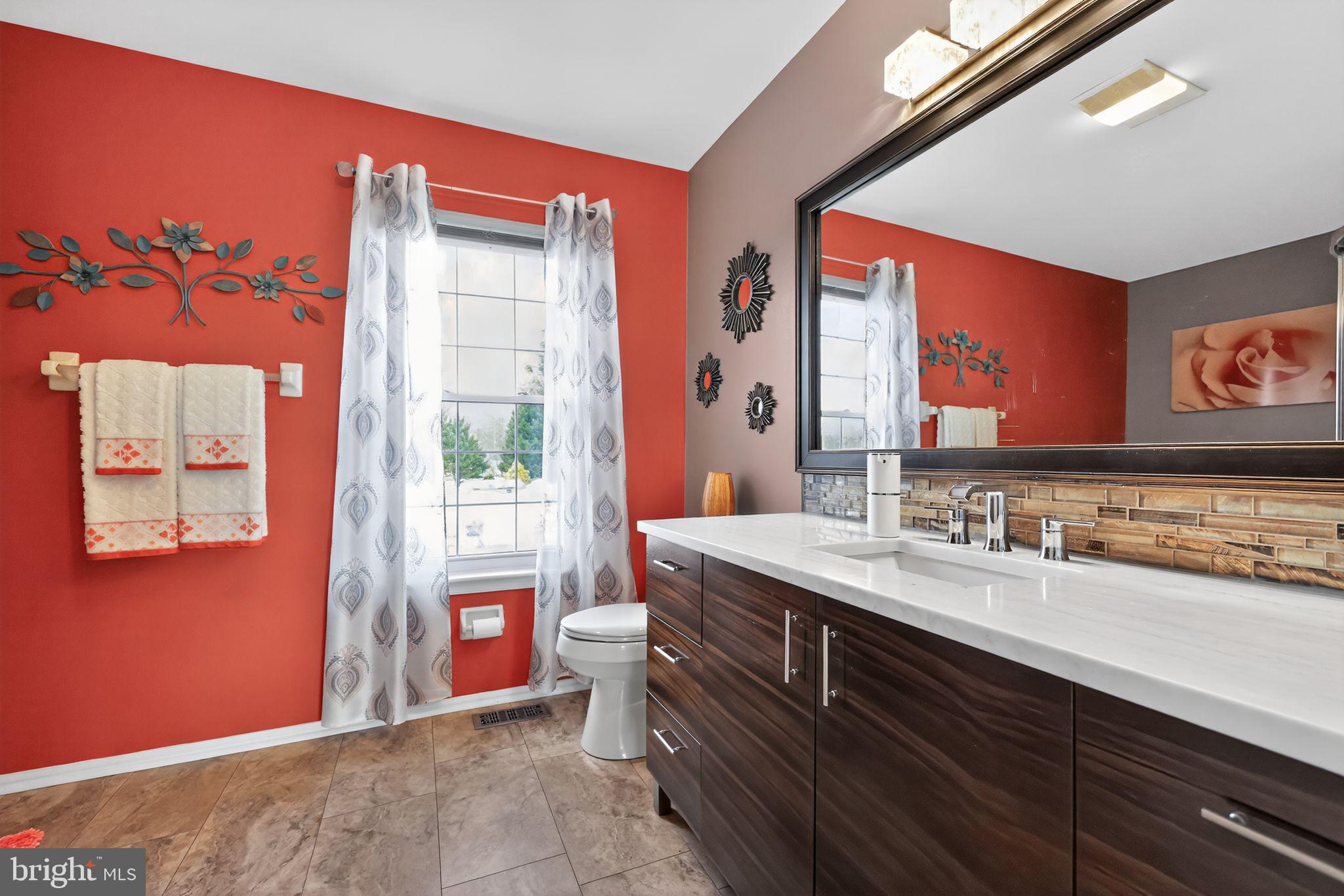11 Pony Run Sewell, NJ 08080 - Photo 23 of 33 a bathroom with a sink mirror and a window