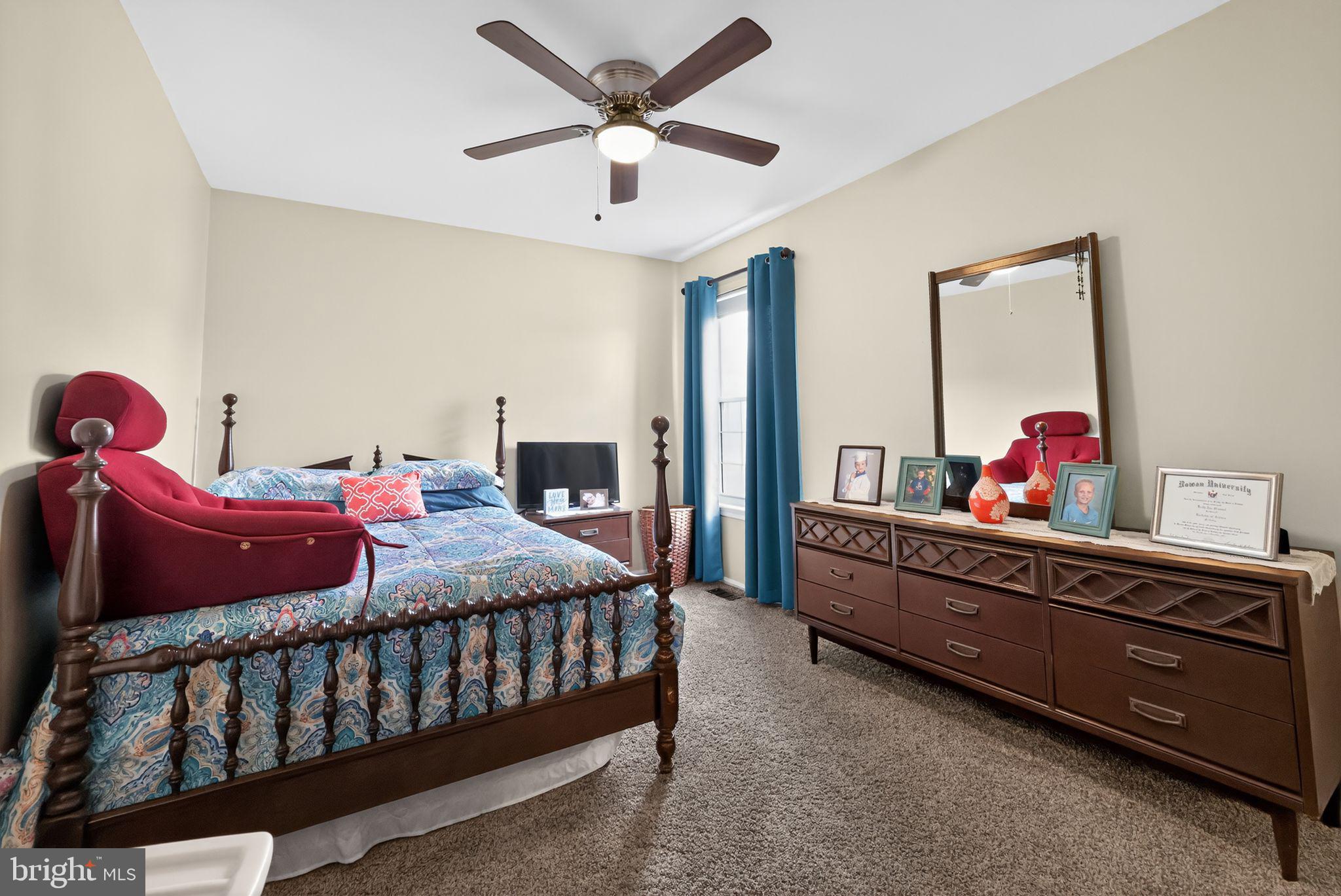 11 Pony Run Sewell, NJ 08080 - Photo 27 of 33 a bedroom with a bed and a chandelier