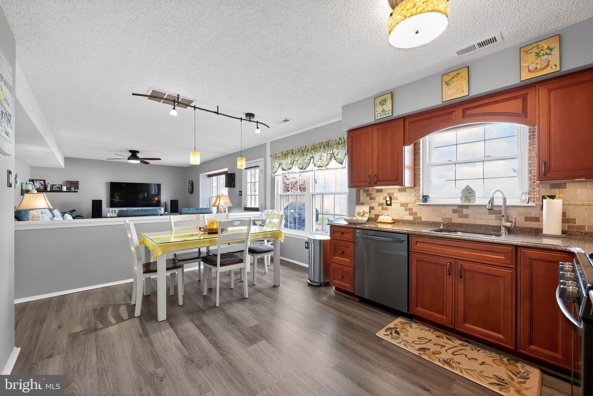11 Pony Run Sewell, NJ 08080 - Photo 10 of 33 a large kitchen with a table and chairs in it