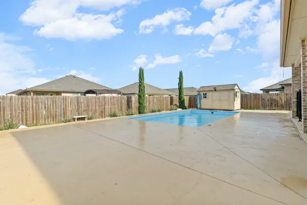 a house view with a sitting space and garden space
