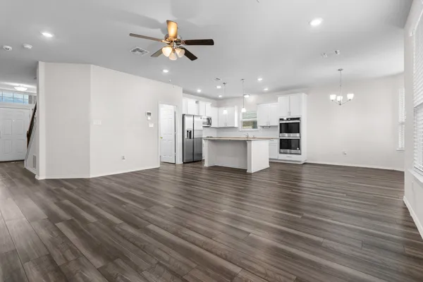 a view of kitchen with cabinets and wooden floor