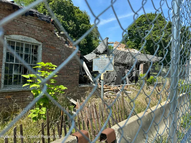 a backyard of a house with outdoor seating
