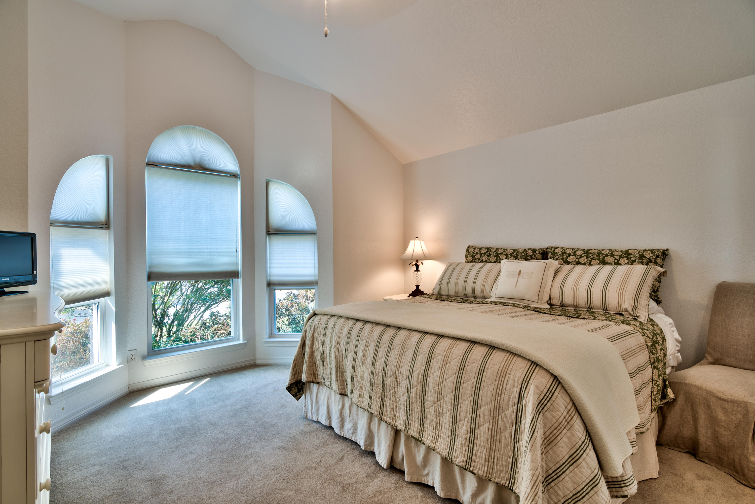 77 Legion Park Loop Miramar Beach, FL 32550 - Photo 17 of 25 a bed sitting in a bedroom next to a window