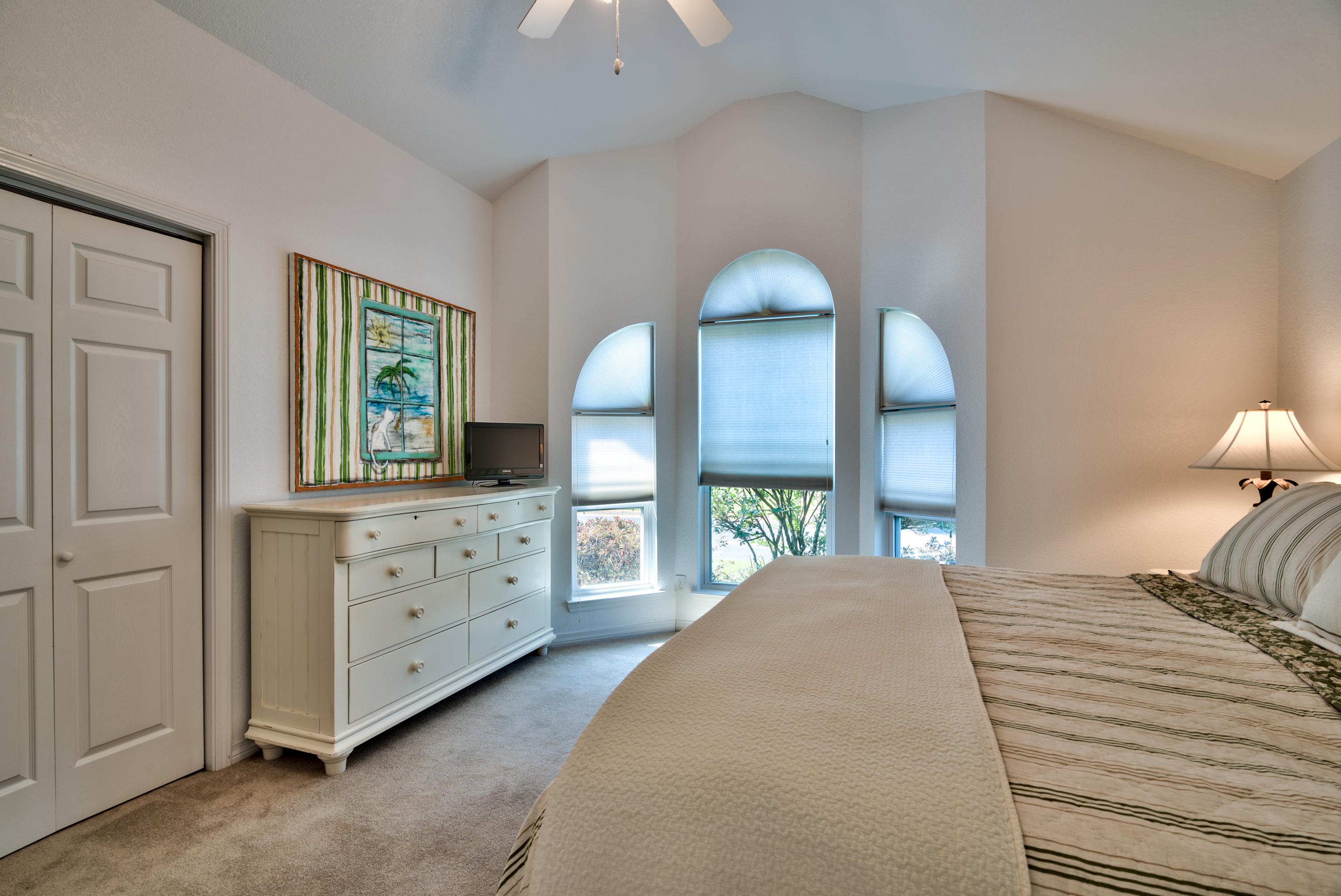 77 Legion Park Loop Miramar Beach, FL 32550 - Photo 19 of 25 a bedroom with a bed and a dresser