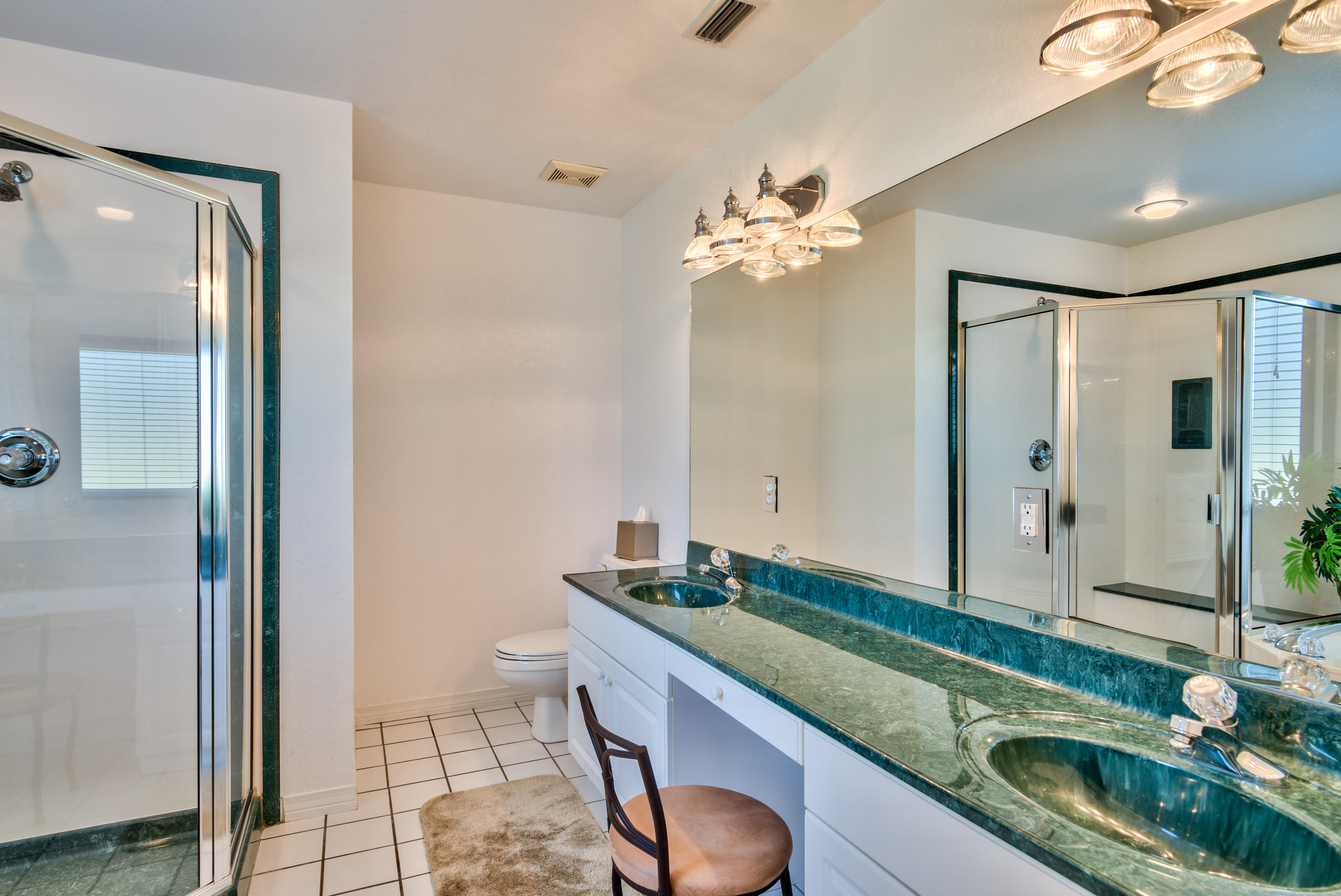 77 Legion Park Loop Miramar Beach, FL 32550 - Photo 20 of 25 a bathroom with a granite countertop sink a mirror and a shower