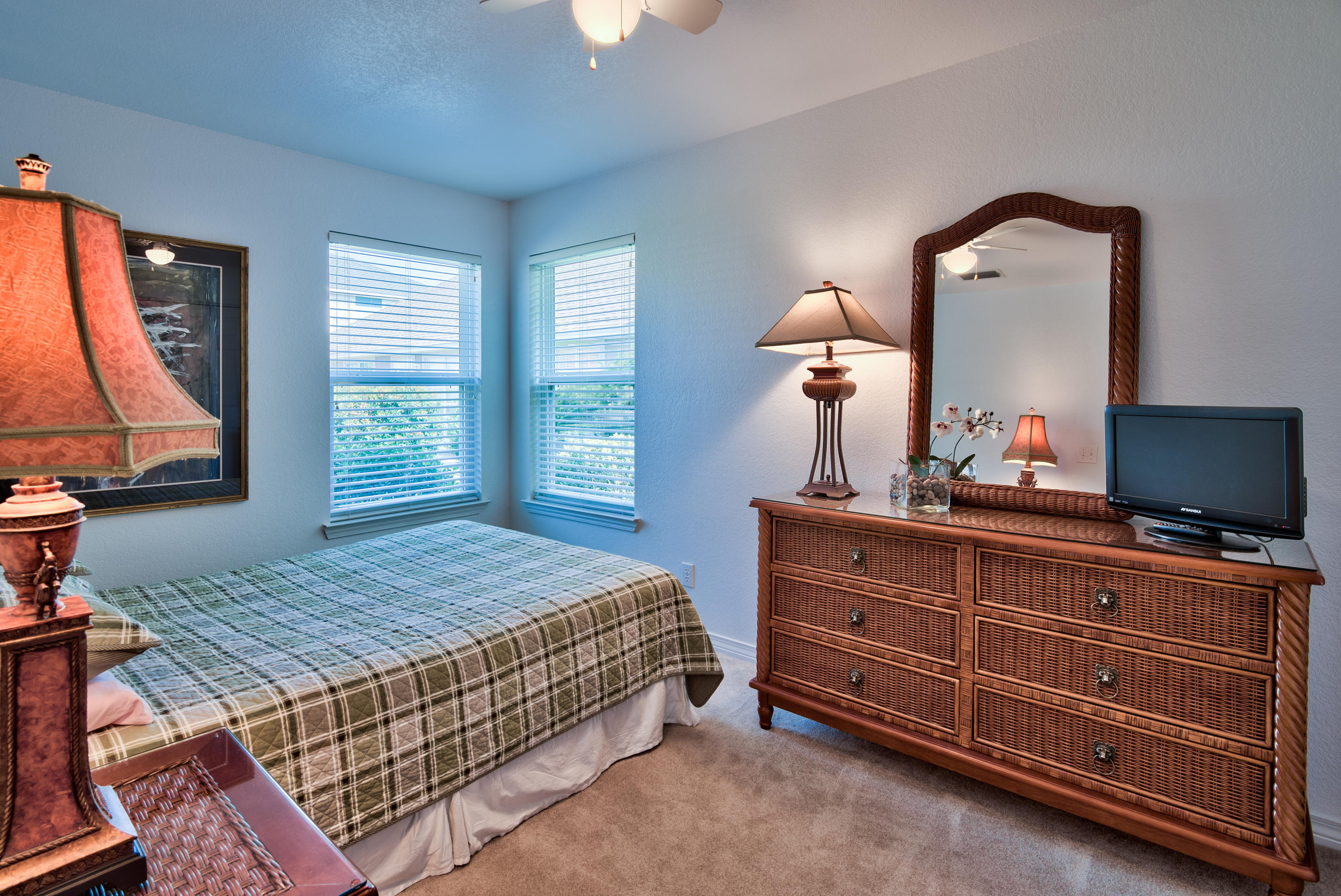77 Legion Park Loop Miramar Beach, FL 32550 - Photo 22 of 25 a bedroom with a bed and wooden floor
