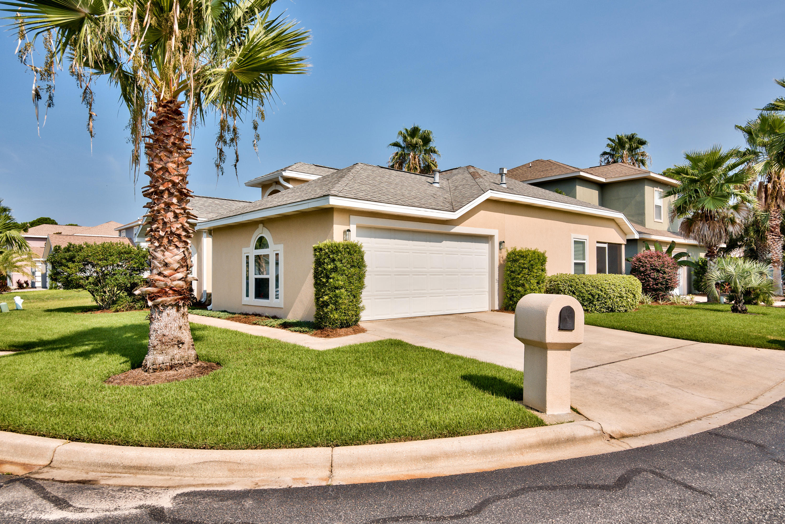 77 Legion Park Loop Miramar Beach, FL 32550 - Photo 3 of 25 a front view of a house with a yard and garage