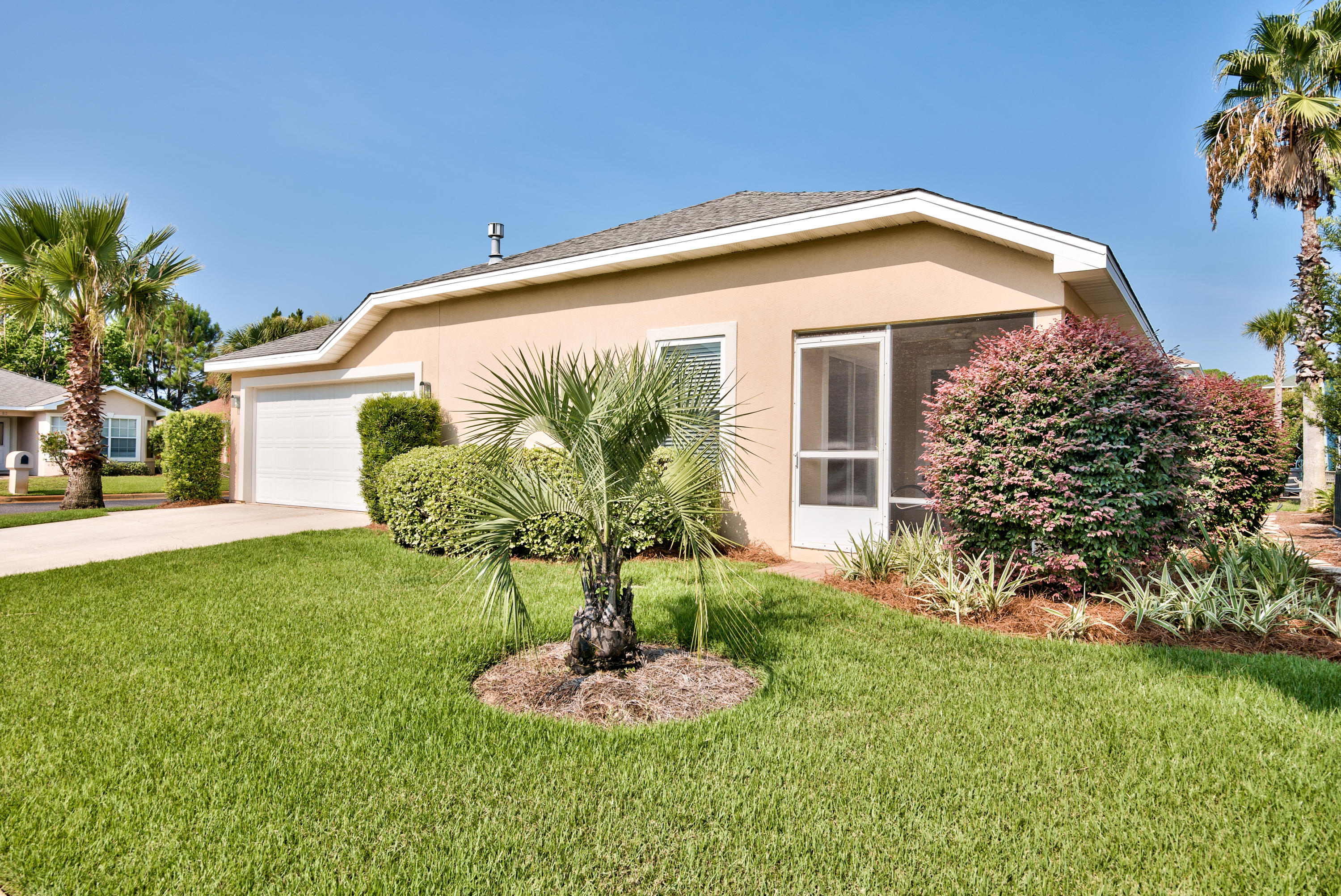 77 Legion Park Loop Miramar Beach, FL 32550 - Photo 4 of 25 a front view of a house with garden
