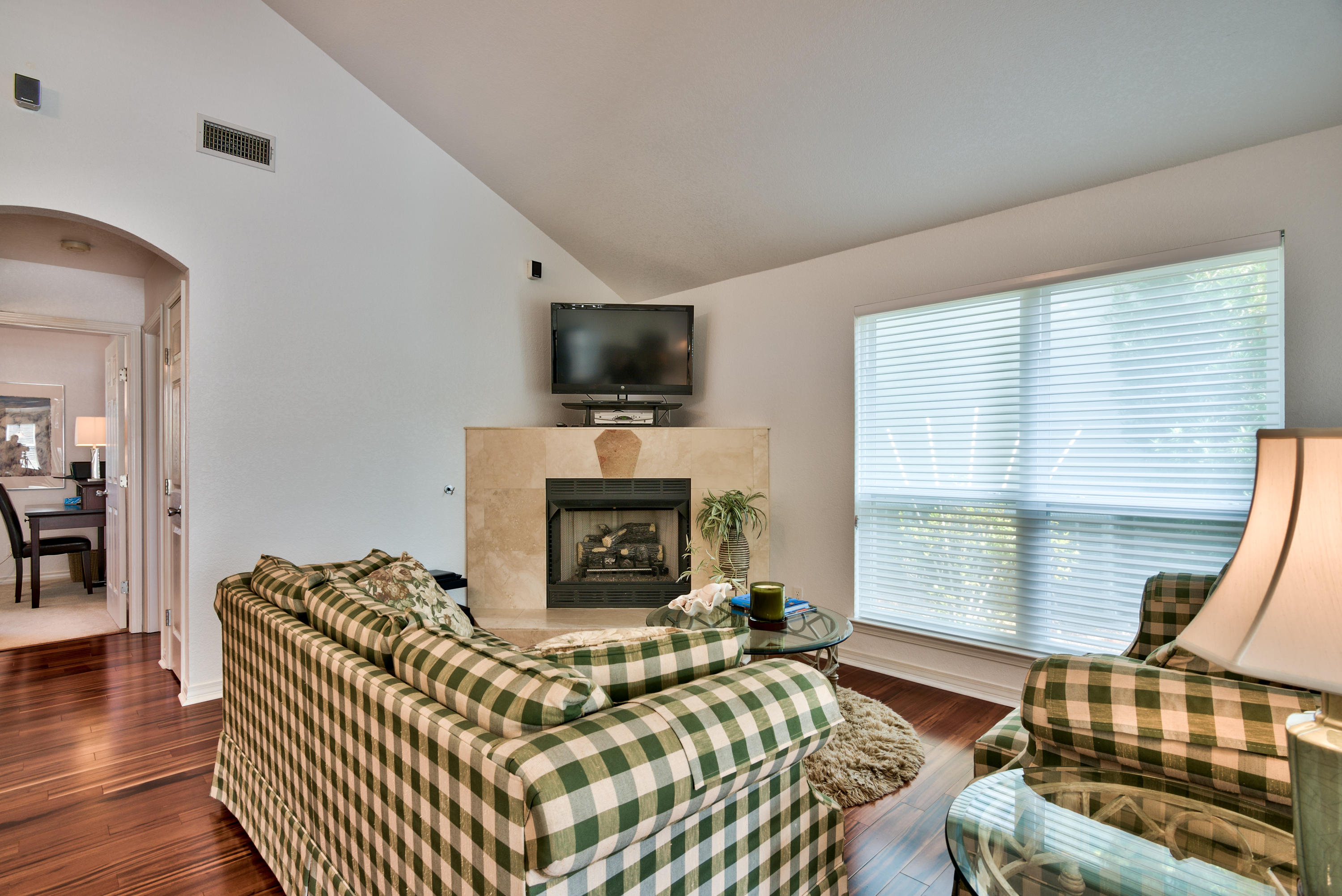 77 Legion Park Loop Miramar Beach, FL 32550 - Photo 7 of 25 a living room with furniture a fireplace and a flat screen tv