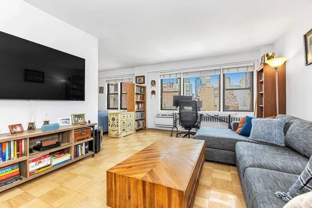 a picture of a bench in front of a wall