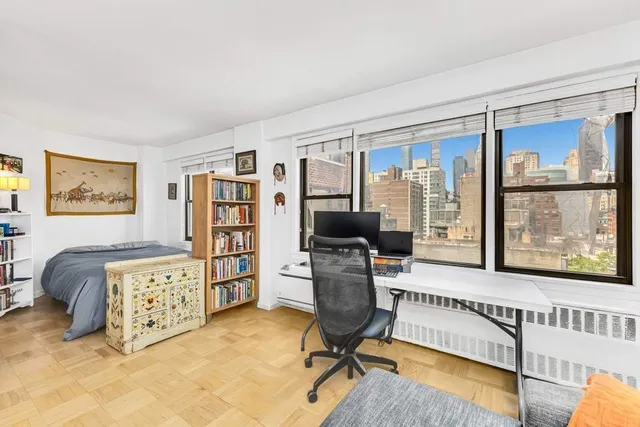 a kitchen with cabinets and white appliances