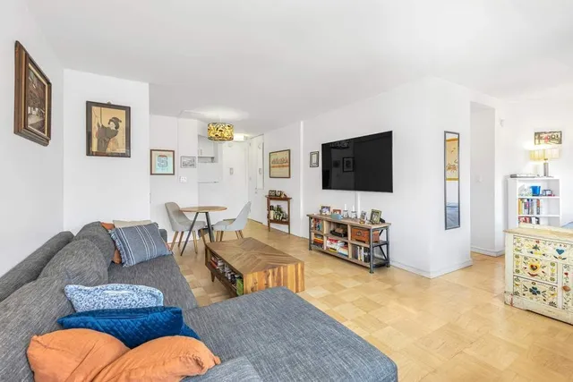 a bathroom with a sink mirror and shower