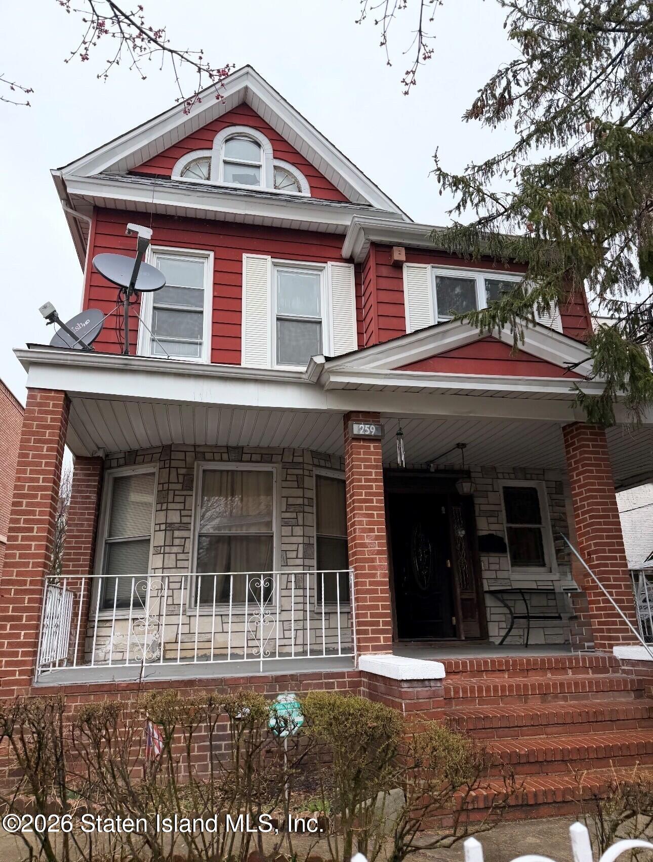 259 80th Street Brooklyn, NY 11209 - Photo 1 of 1 a view of a white house with large windows