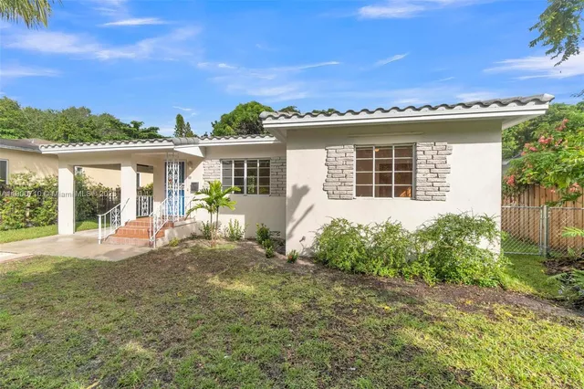 front view of a house with a yard