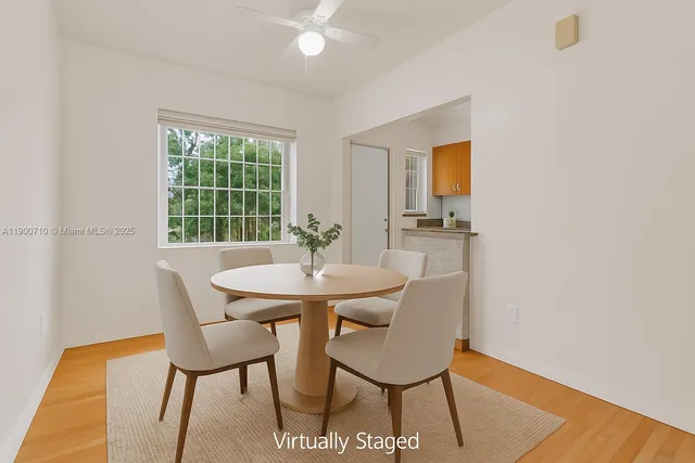 a view of a dining room with furniture and window