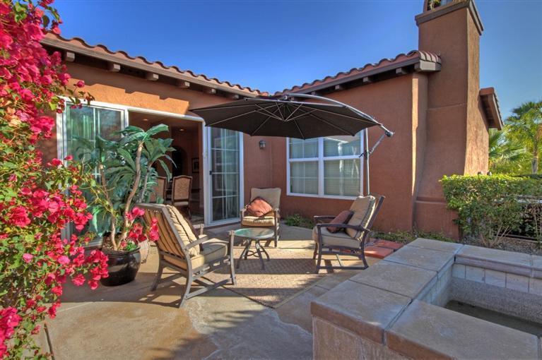 3 Via Santa Elena Rancho Mirage, CA 92270 - Photo 15 of 33 a view of patio with a table and chairs under an umbrella