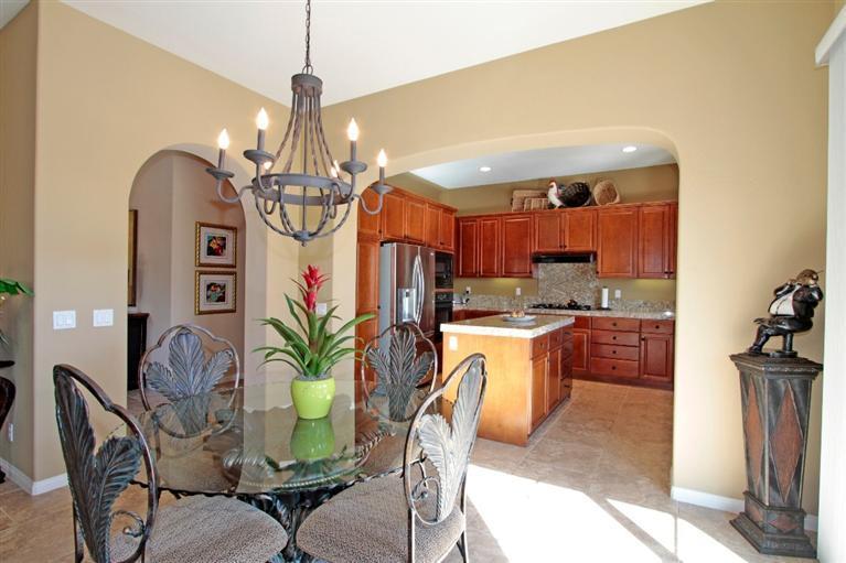 3 Via Santa Elena Rancho Mirage, CA 92270 - Photo 16 of 33 a dining room with furniture a chandelier and kitchen view