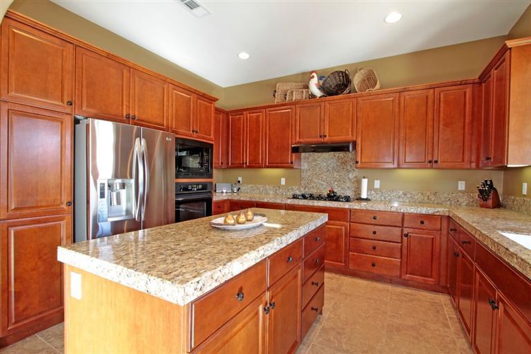 3 Via Santa Elena Rancho Mirage, CA 92270 - Photo 17 of 33 a kitchen with stainless steel appliances granite countertop a sink refrigerator and cabinets