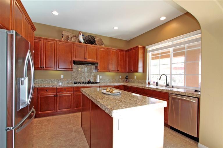 3 Via Santa Elena Rancho Mirage, CA 92270 - Photo 18 of 33 a kitchen with stainless steel appliances granite countertop a sink stove and refrigerator