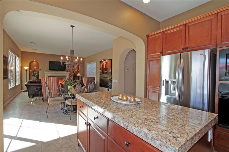 3 Via Santa Elena Rancho Mirage, CA 92270 - Photo 19 of 33 a kitchen with stainless steel appliances granite countertop a sink refrigerator and cabinets
