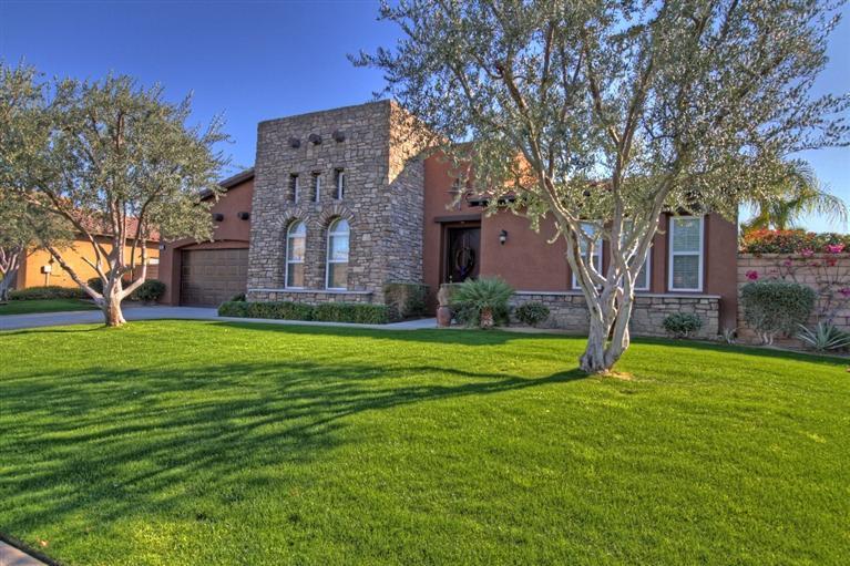 3 Via Santa Elena Rancho Mirage, CA 92270 - Photo 2 of 33 a large brick building with a big yard and large trees